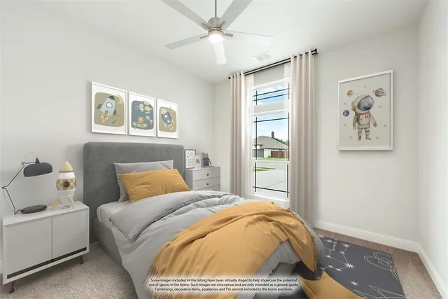 a bedroom with a bed and painting on the wall