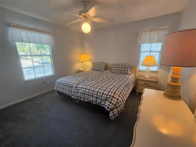 a bedroom with a bed and lamp