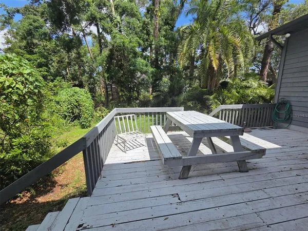 a view of outdoor space with seating and trees