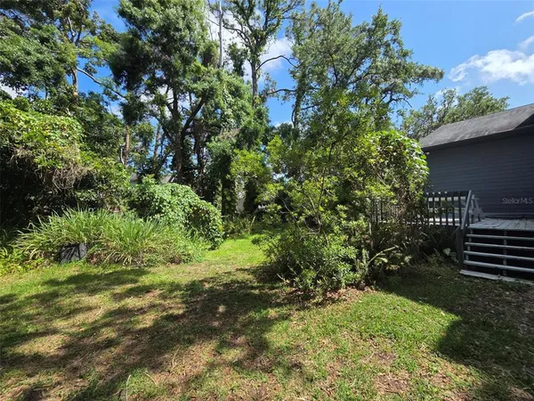 a backyard of a house with lots of green space