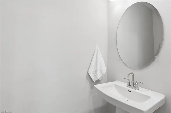 a room with a sink and cabinets