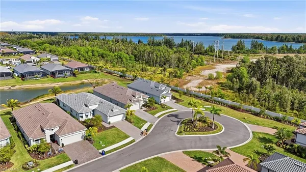 an aerial view of residential house with outdoor space and swimming pool