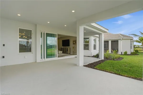 a view of a room with balcony and ocean view