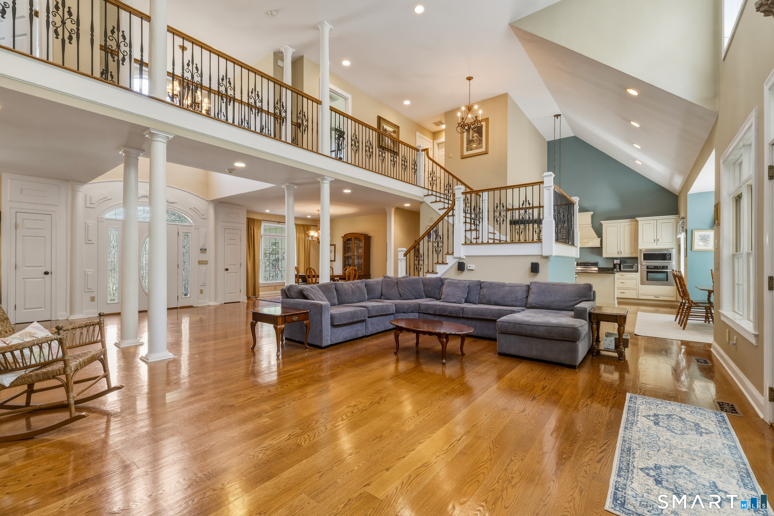 122 Lower Road Guilford, CT 06437 - Photo 8 of 40 Foyer seamlessly transitions to the dramatic two-story family room, ideal for both everyday living and entertaining.