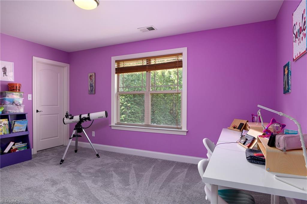 8931 Grove Park Drive Oak Ridge, NC 27310 - Photo 24 of 36 Bedroom 2