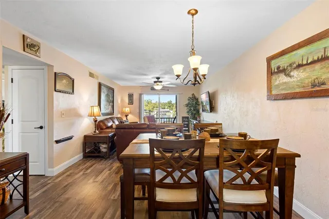 a kitchen with stainless steel appliances granite countertop a refrigerator stove and microwave