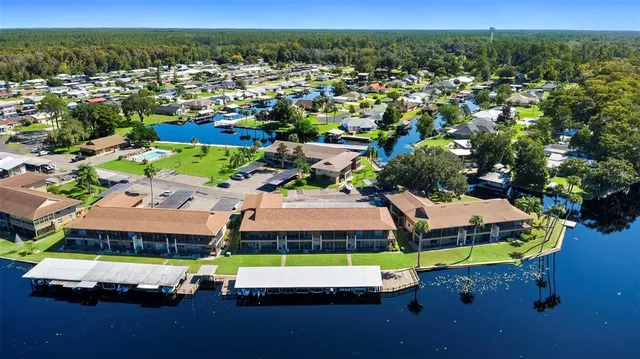front view of a brick building with a yard