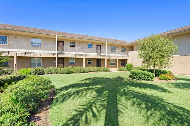 a view of a dining room with furniture wooden floor and a clock