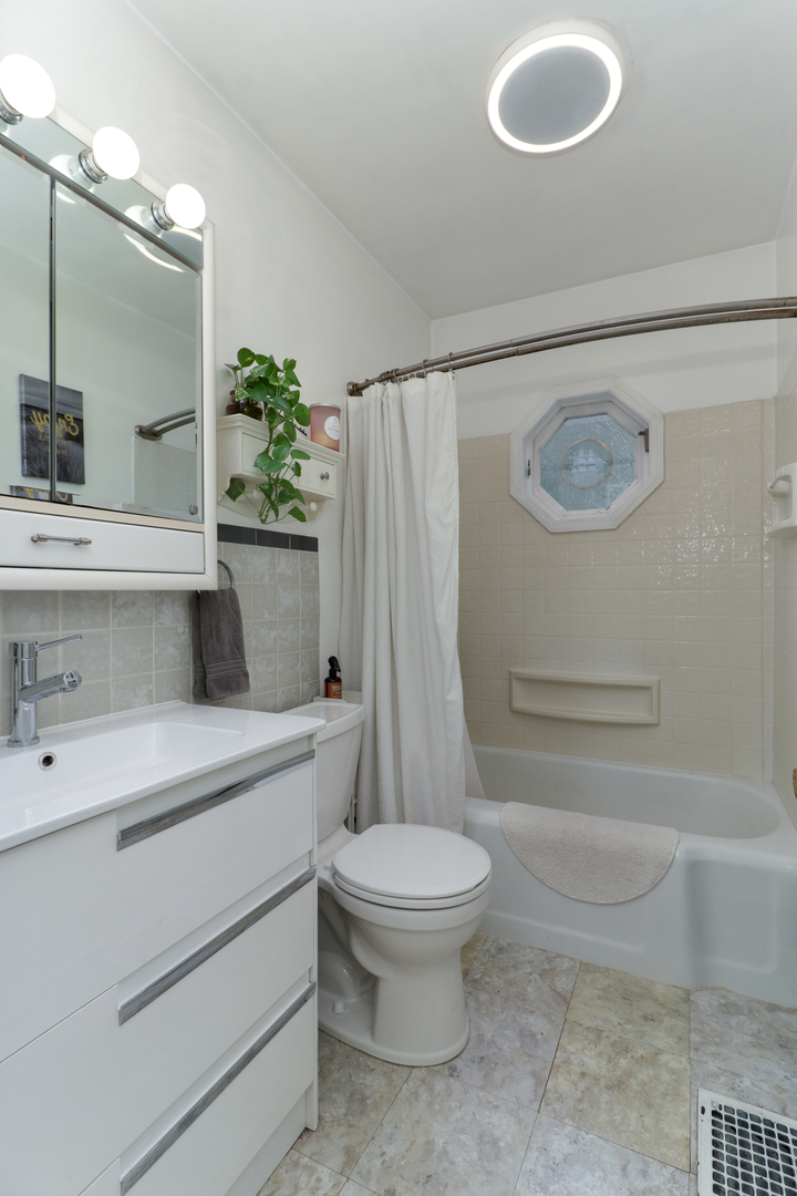 4 University Court Normal, IL 61761 - Photo 30 of 54 a bathroom with a sink a toilet and shower