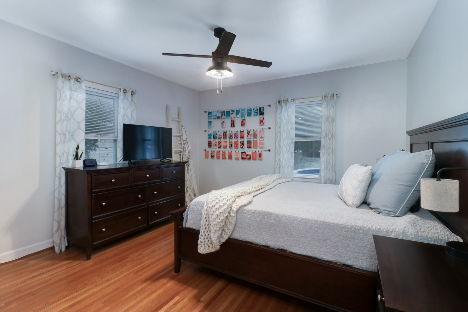 4 University Court Normal, IL 61761 - Photo 32 of 54 a bedroom with a bed and a flat screen tv