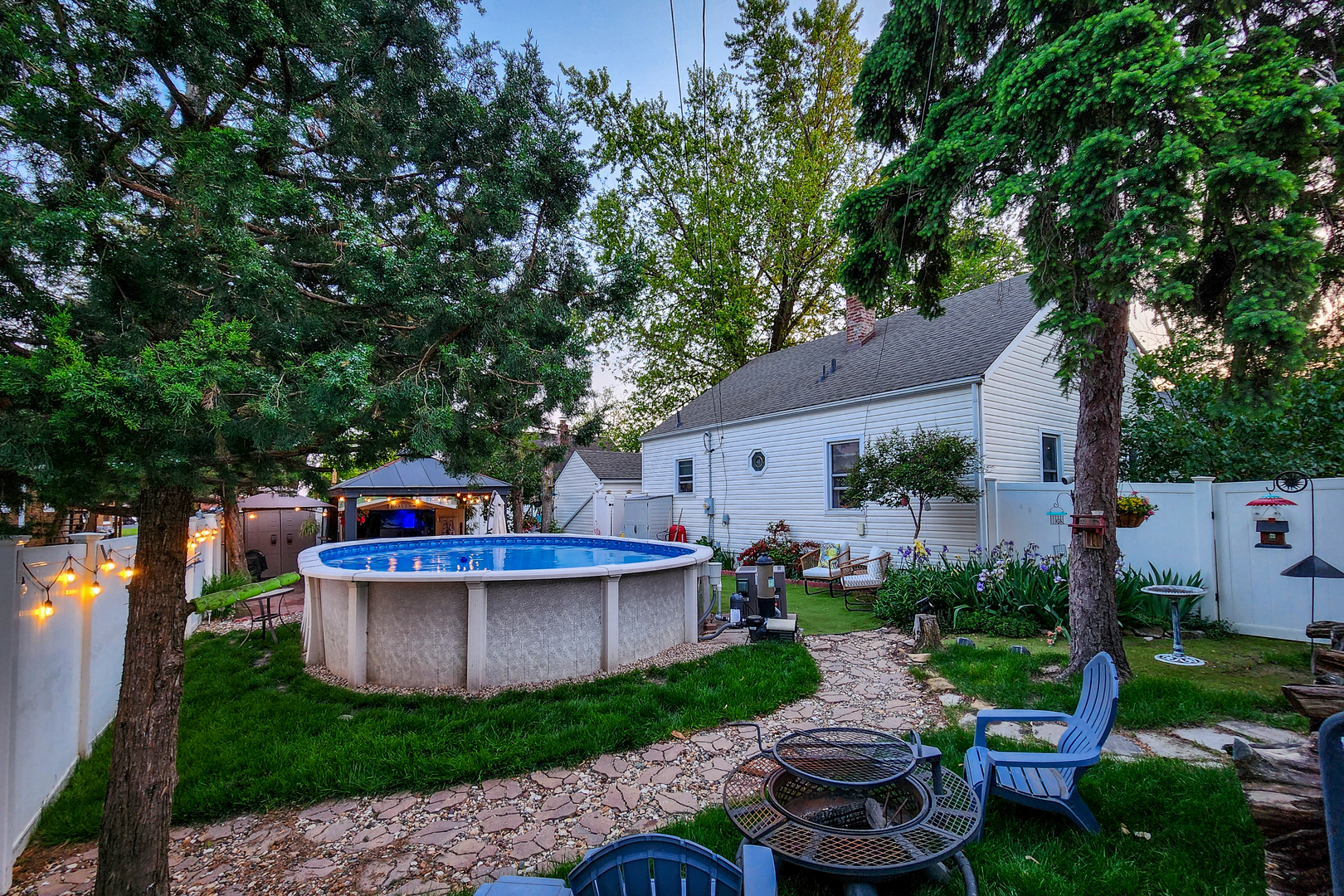 4 University Court Normal, IL 61761 - Photo 5 of 54 a view of a chair and table in backyard of the house