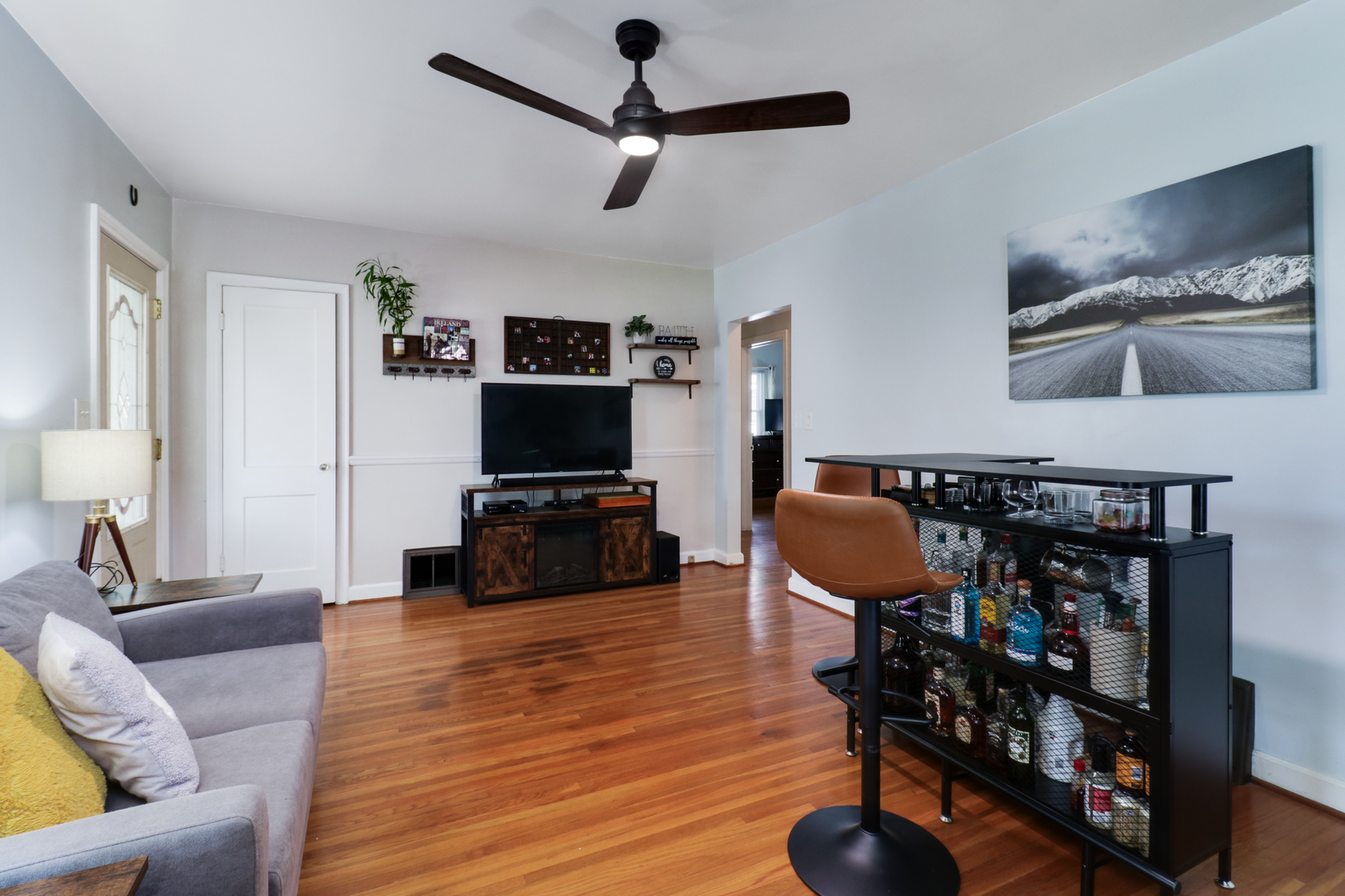 4 University Court Normal, IL 61761 - Photo 9 of 54 a living room with furniture a flat screen tv and a table