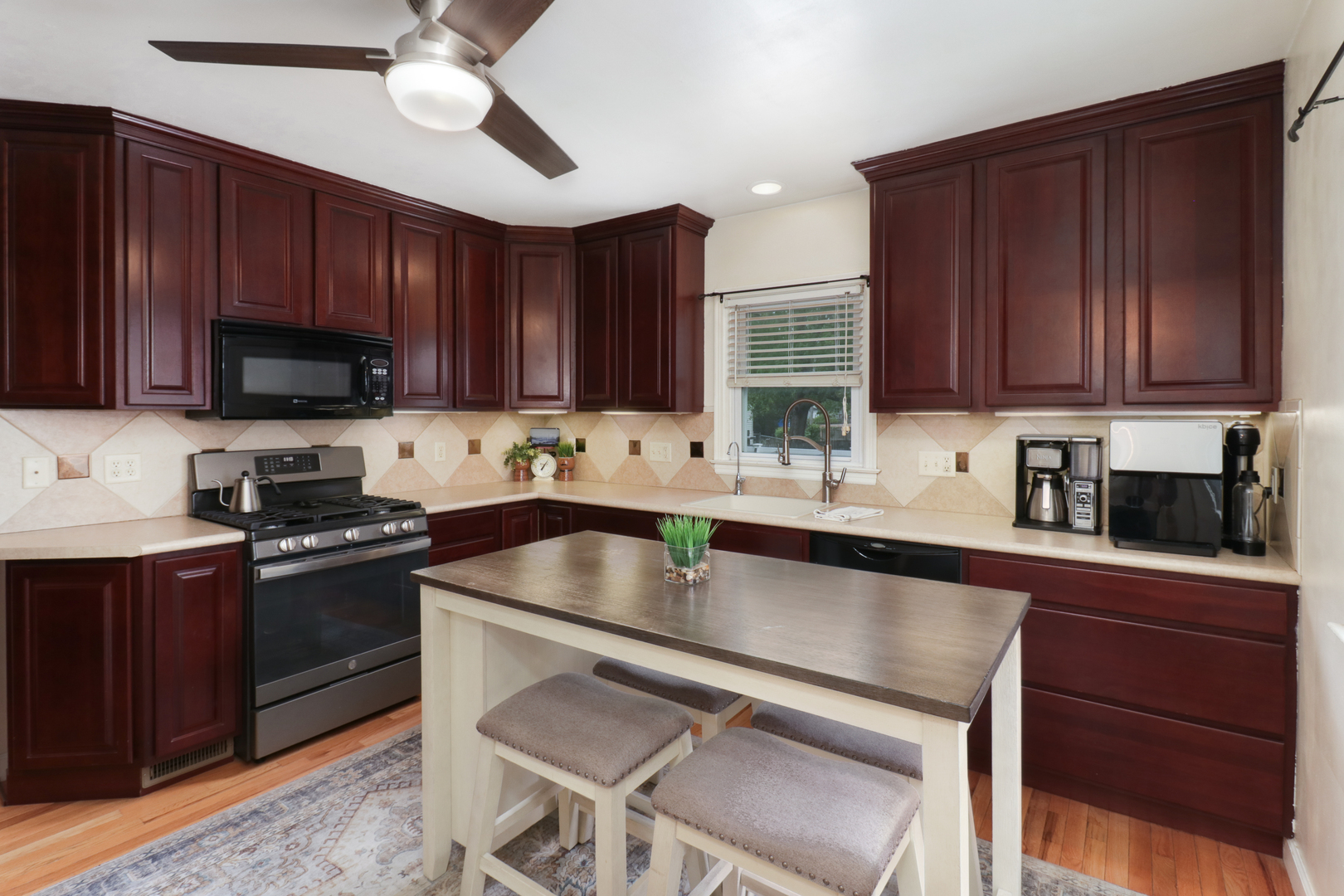 4 University Court Normal, IL 61761 - Photo 10 of 54 a kitchen with a sink cabinets and stainless steel appliances