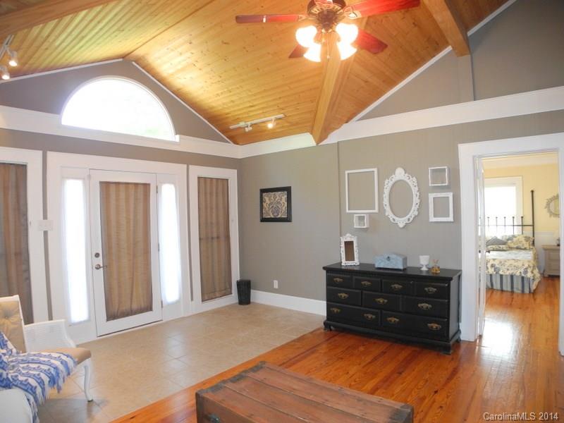 617 Blacksnake Road Stanley, NC 28164 - Photo 11 of 24 a living room with couches and dresser with wooden floor