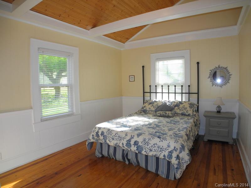 617 Blacksnake Road Stanley, NC 28164 - Photo 12 of 24 a bedroom with a bed and wooden floor
