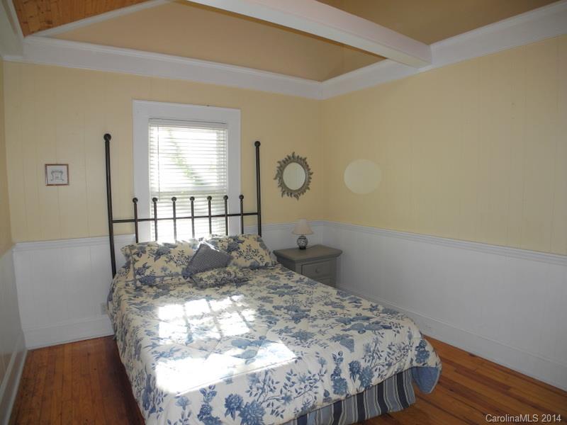 617 Blacksnake Road Stanley, NC 28164 - Photo 13 of 24 a bed sitting in a bedroom next to a window