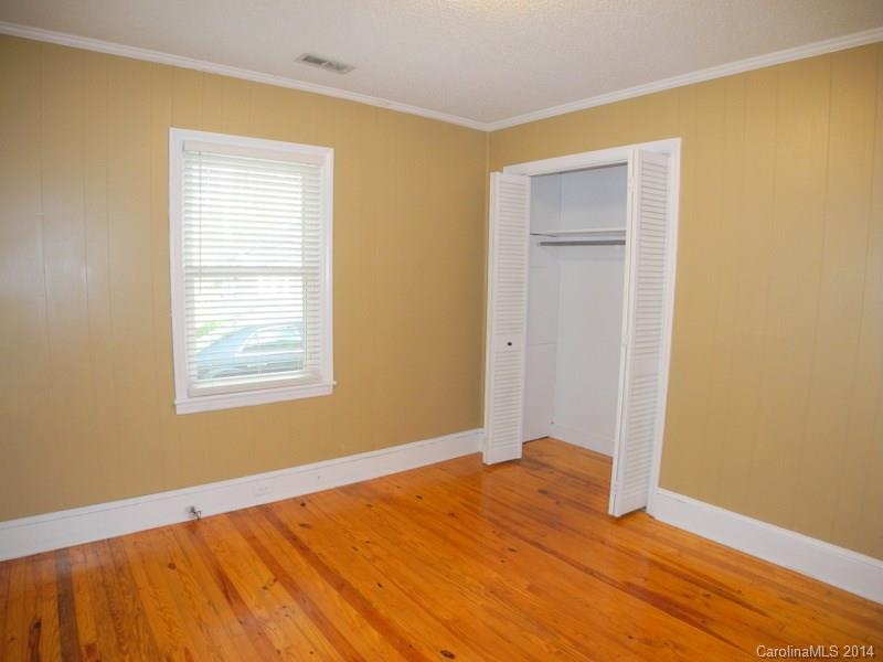 617 Blacksnake Road Stanley, NC 28164 - Photo 16 of 24 a view of empty room with wooden floor