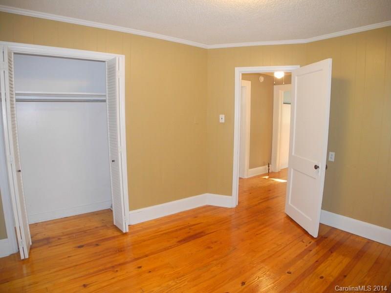 617 Blacksnake Road Stanley, NC 28164 - Photo 17 of 24 a view of empty room with wooden floor