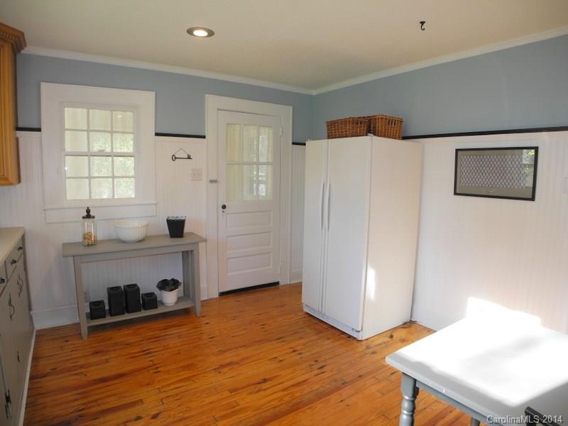 617 Blacksnake Road Stanley, NC 28164 - Photo 21 of 24 a view of an empty room with a window and wooden floor