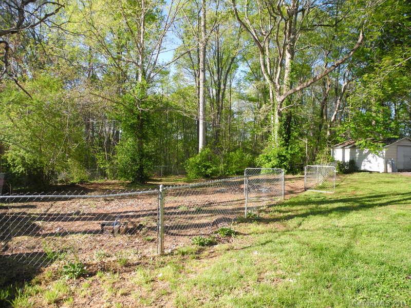 617 Blacksnake Road Stanley, NC 28164 - Photo 5 of 24 a view of a yard with a house and large trees