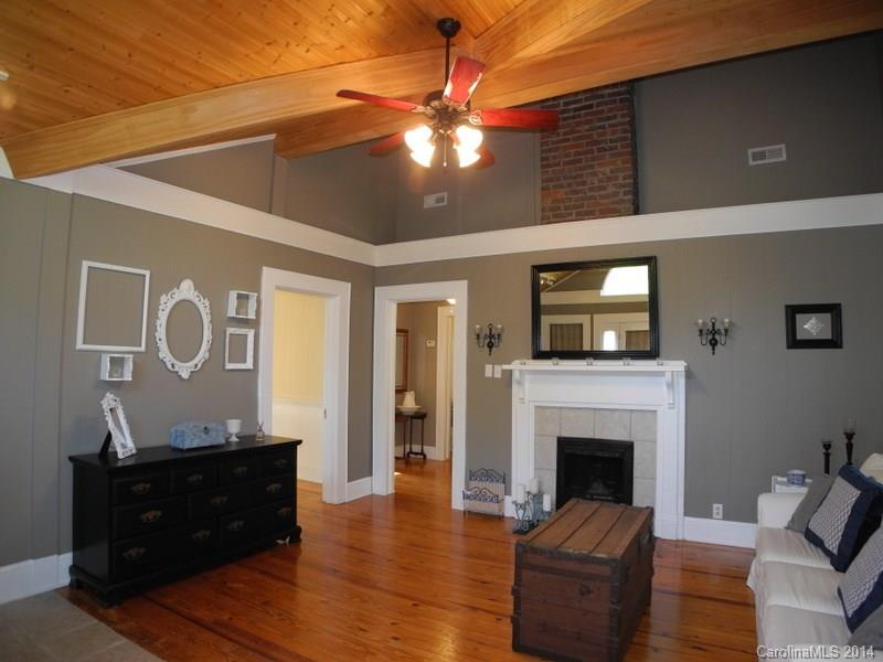 617 Blacksnake Road Stanley, NC 28164 - Photo 7 of 24 a living room with furniture and a fireplace