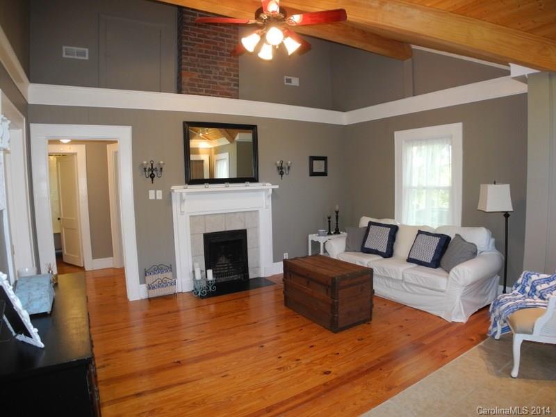 617 Blacksnake Road Stanley, NC 28164 - Photo 8 of 24 a living room with furniture and a fireplace