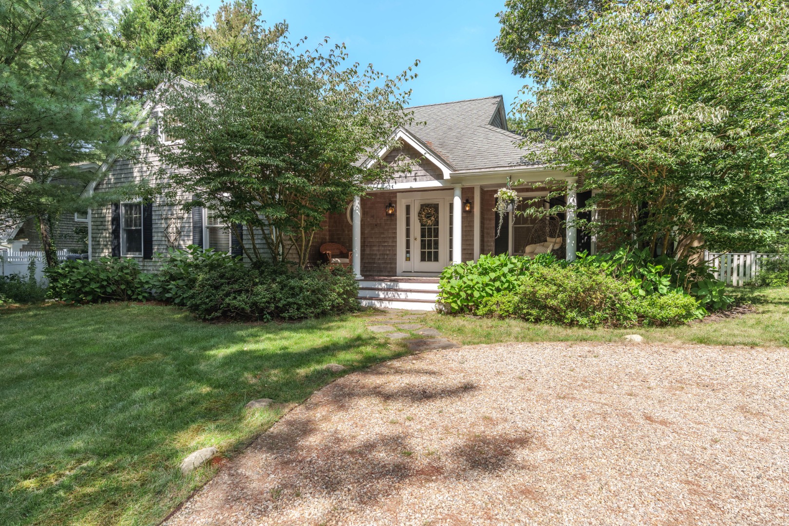 165 West Tisbury Road Edgartown, MA 02539 - Photo 1 of 29 front view of house with a yard and potted plants