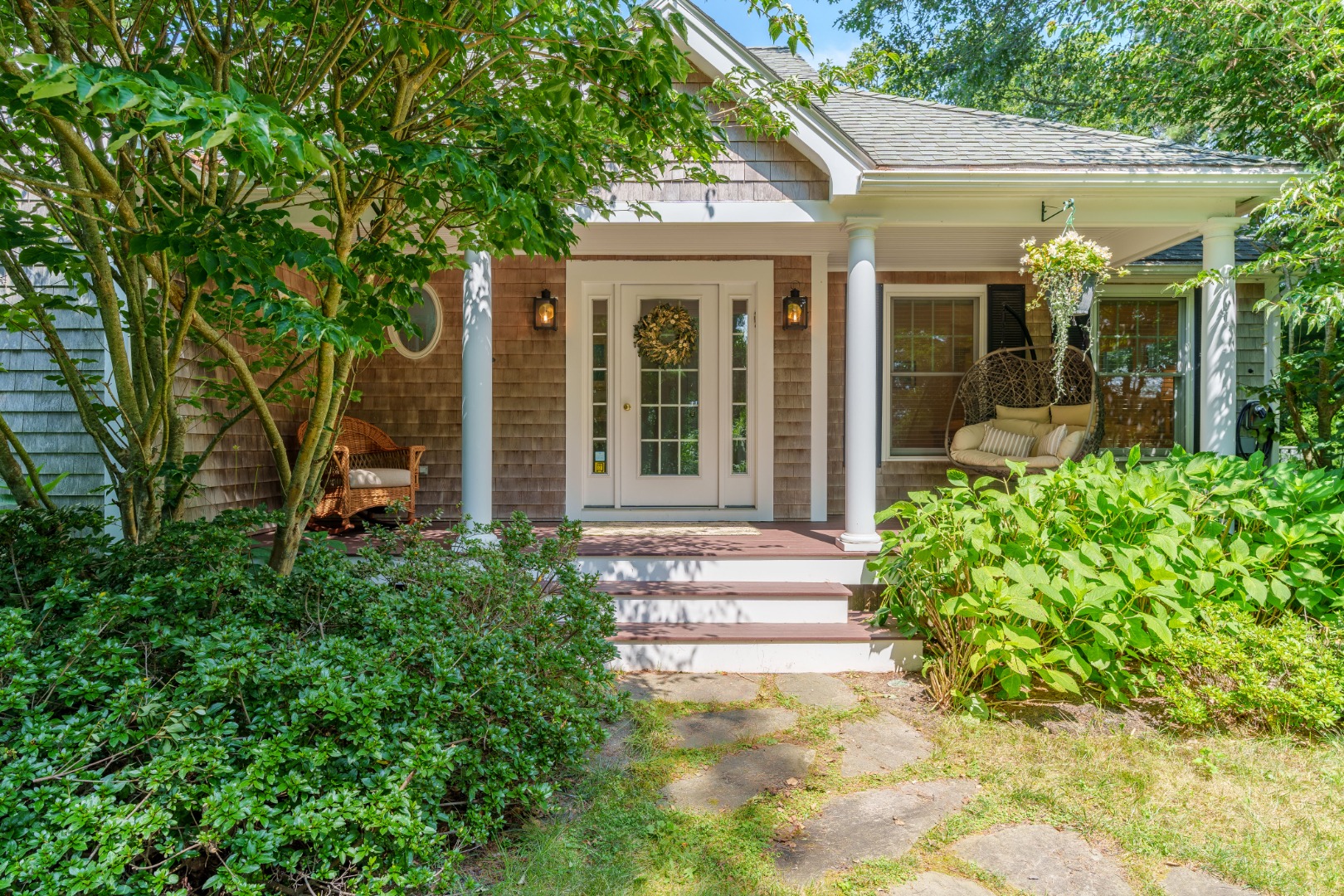 165 West Tisbury Road Edgartown, MA 02539 - Photo 2 of 29 a view of a house with potted plants and a large tree