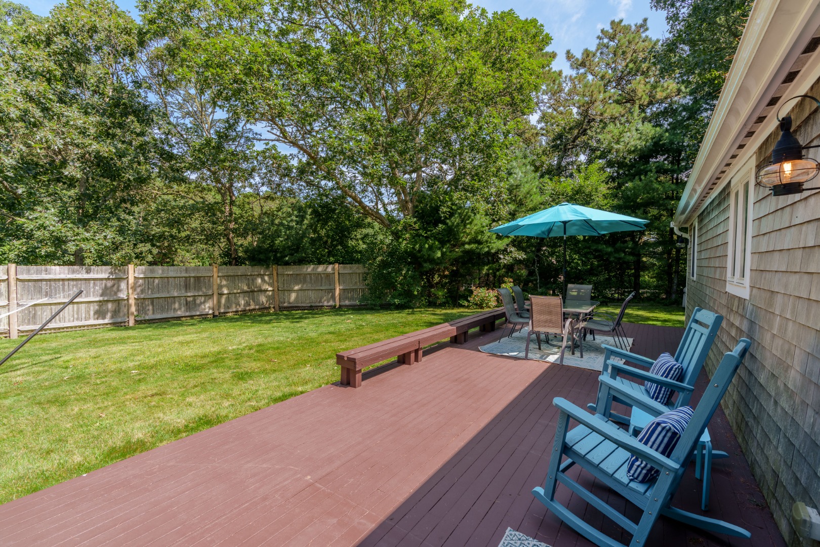165 West Tisbury Road Edgartown, MA 02539 - Photo 22 of 29 a view of a chair and table on the wooden deck