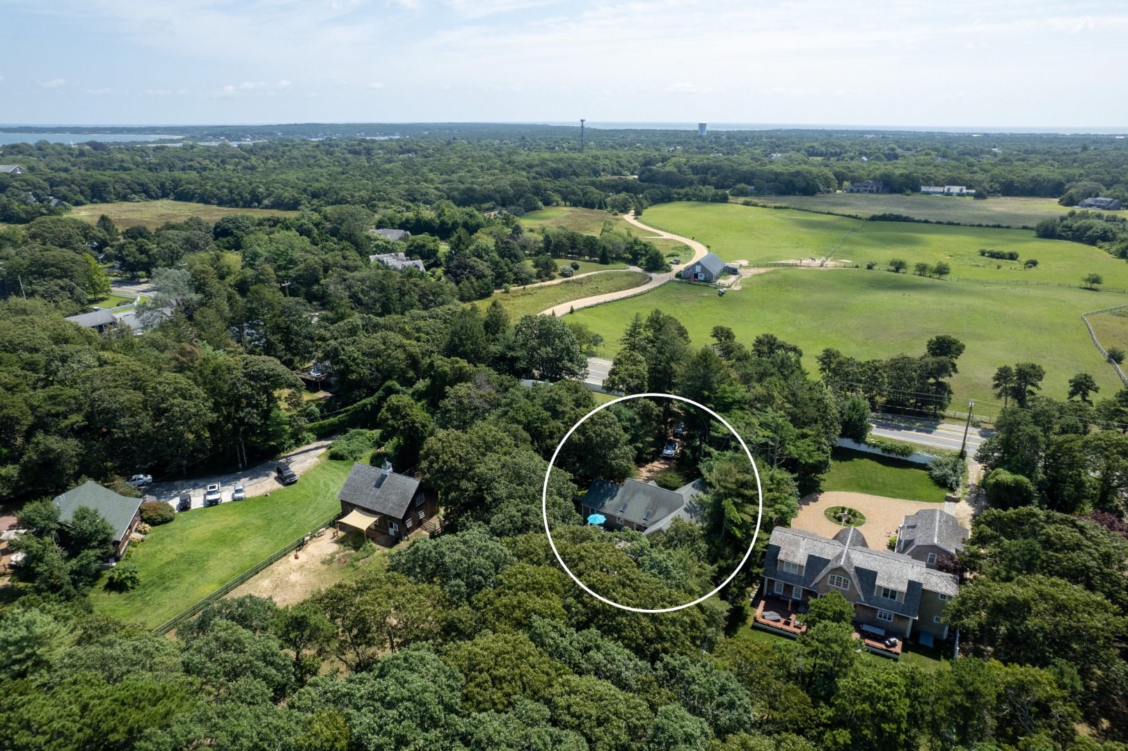 165 West Tisbury Road Edgartown, MA 02539 - Photo 24 of 29 an aerial view of residential houses with outdoor space and swimming pool
