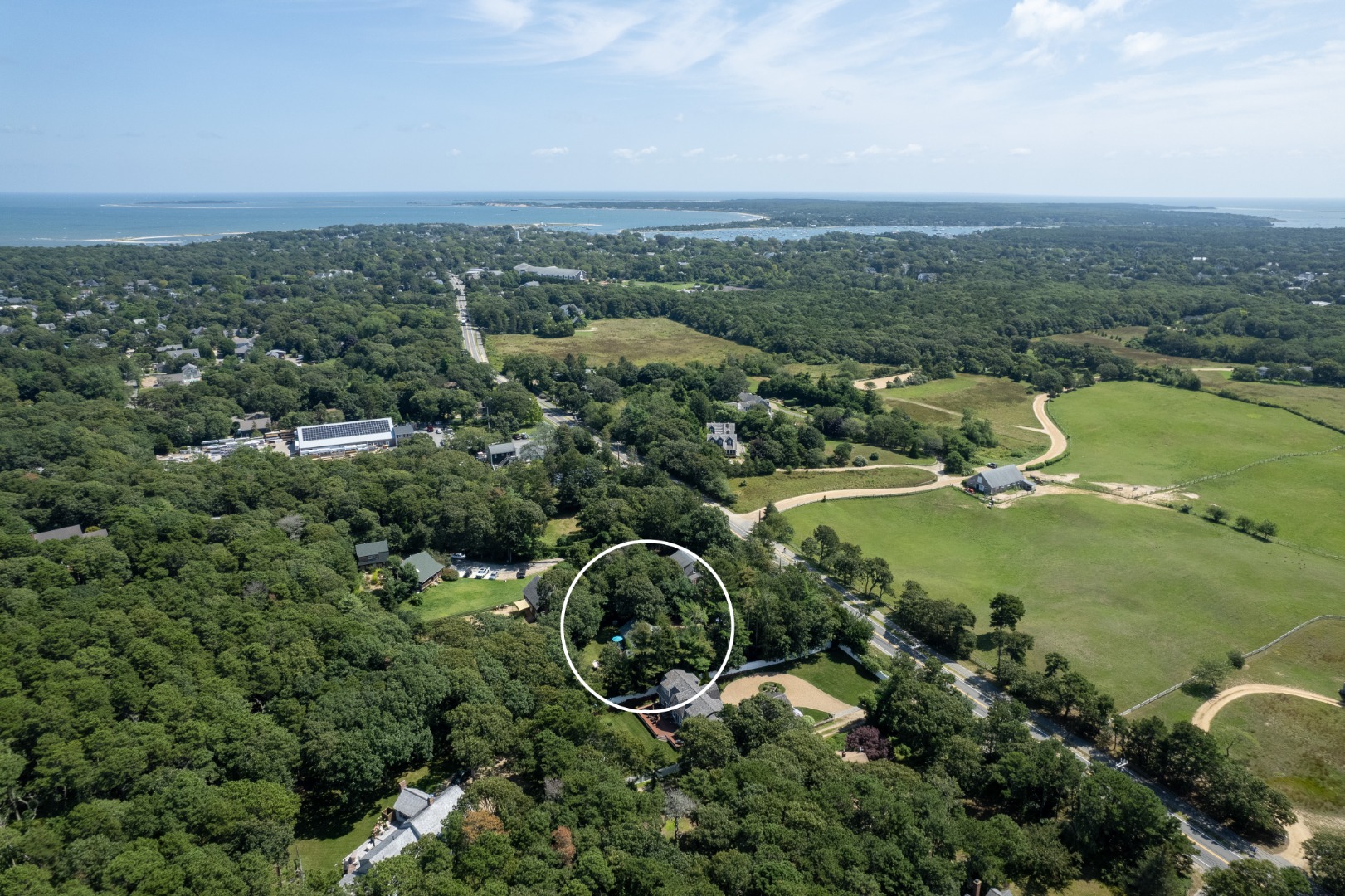 165 West Tisbury Road Edgartown, MA 02539 - Photo 25 of 29 an aerial view of a residential houses with outdoor space and trees
