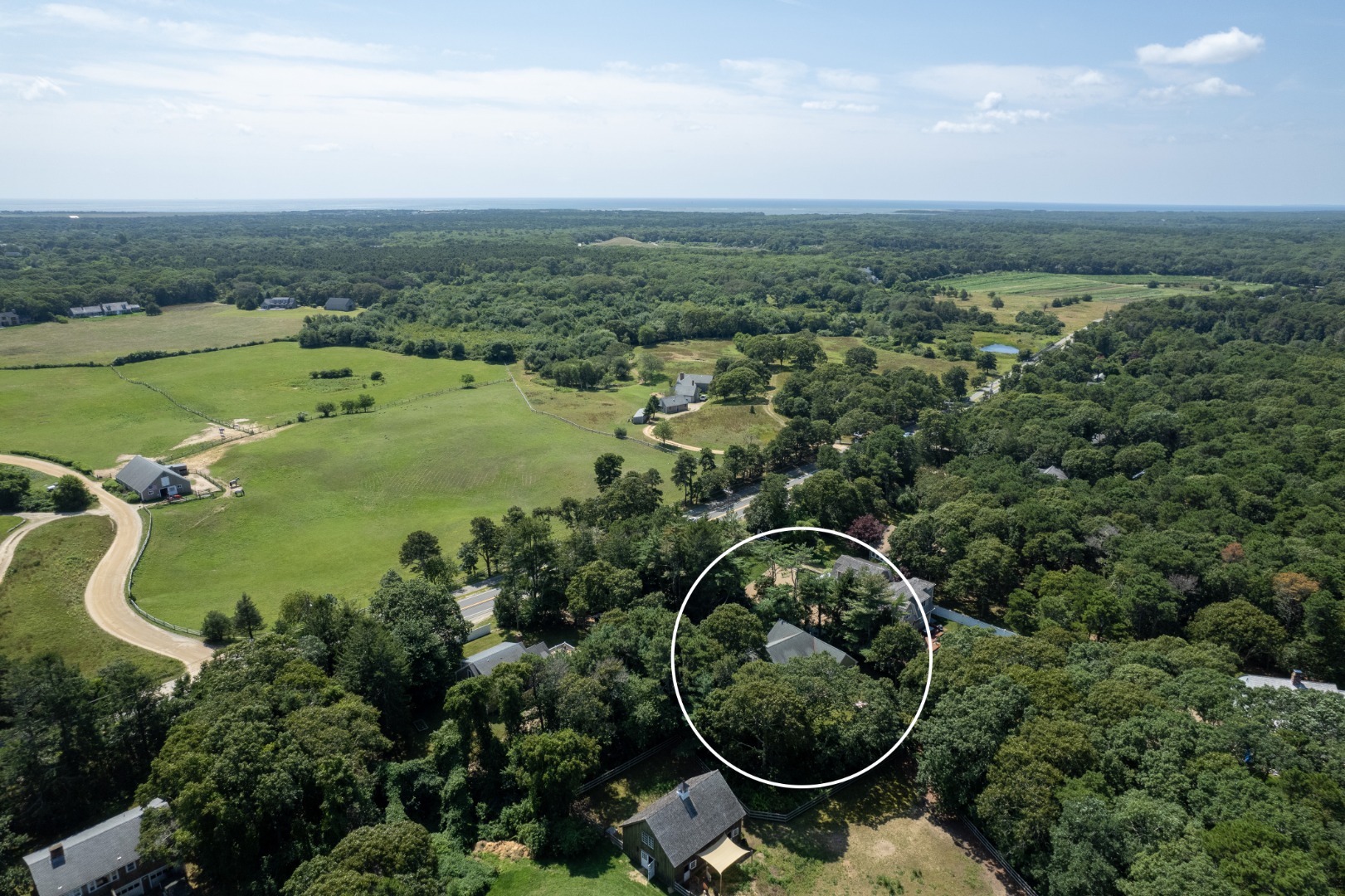 165 West Tisbury Road Edgartown, MA 02539 - Photo 26 of 29 an aerial view of a residential houses with outdoor space and trees all around