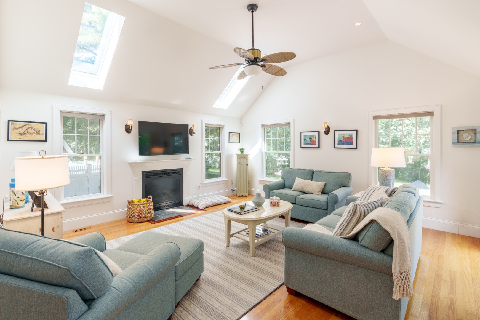 165 West Tisbury Road Edgartown, MA 02539 - Photo 7 of 29 a living room with furniture a fireplace and a flat screen tv