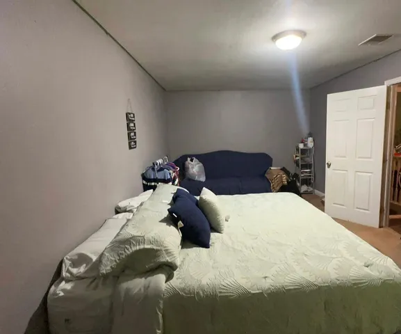 kids room with toys and wooden floor