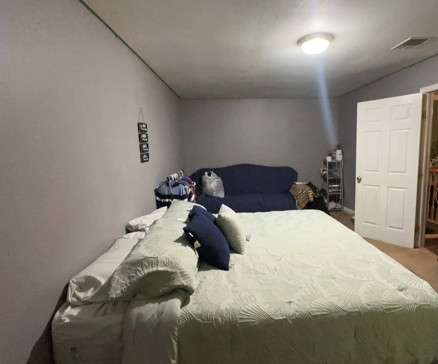 2629 Kowis Street Houston, TX 77093 - Photo 12 of 17 a bedroom with a bed and a lamp