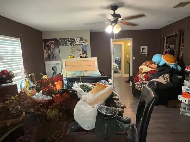 a view of walk in closet with clothes