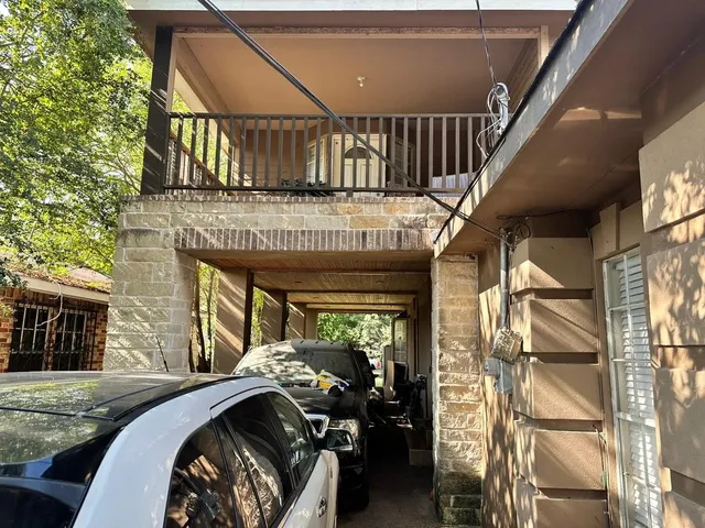 a kitchen with a table chairs stove and refrigerator