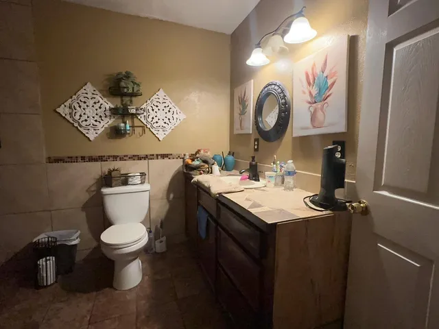 a bathroom with a toilet and shower