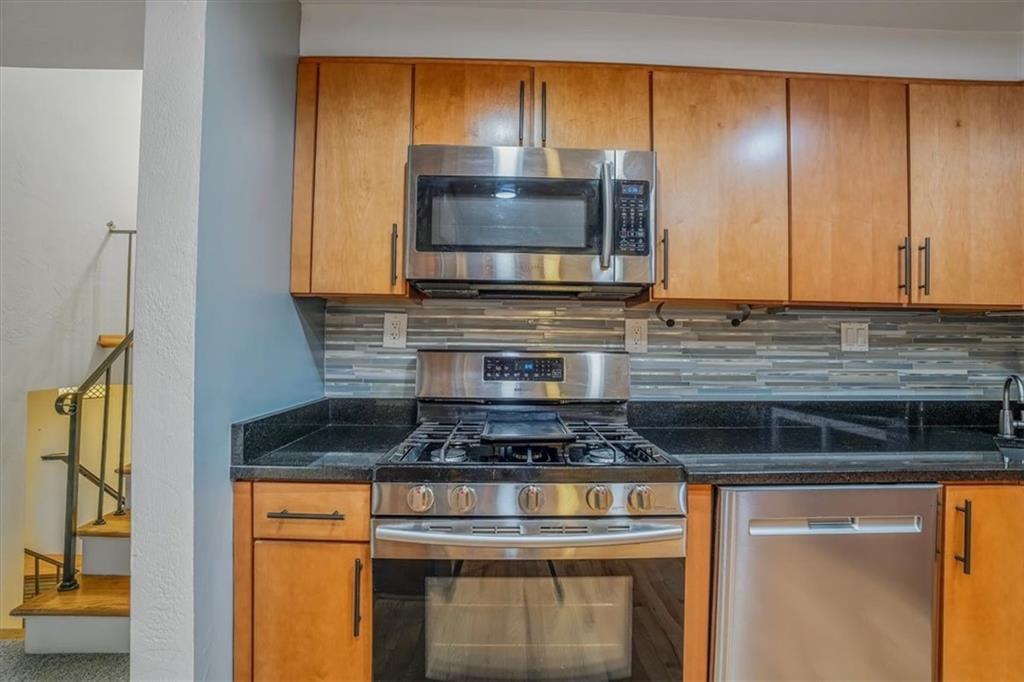 2341 Sample Road Allison Park, PA 15101 - Photo 13 of 50 a kitchen with granite countertop wood cabinets and stainless steel appliances