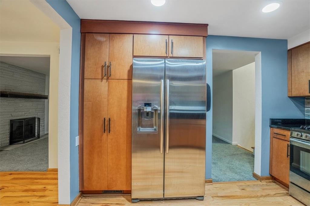 2341 Sample Road Allison Park, PA 15101 - Photo 14 of 50 a view of a refrigerator in kitchen and an empty room