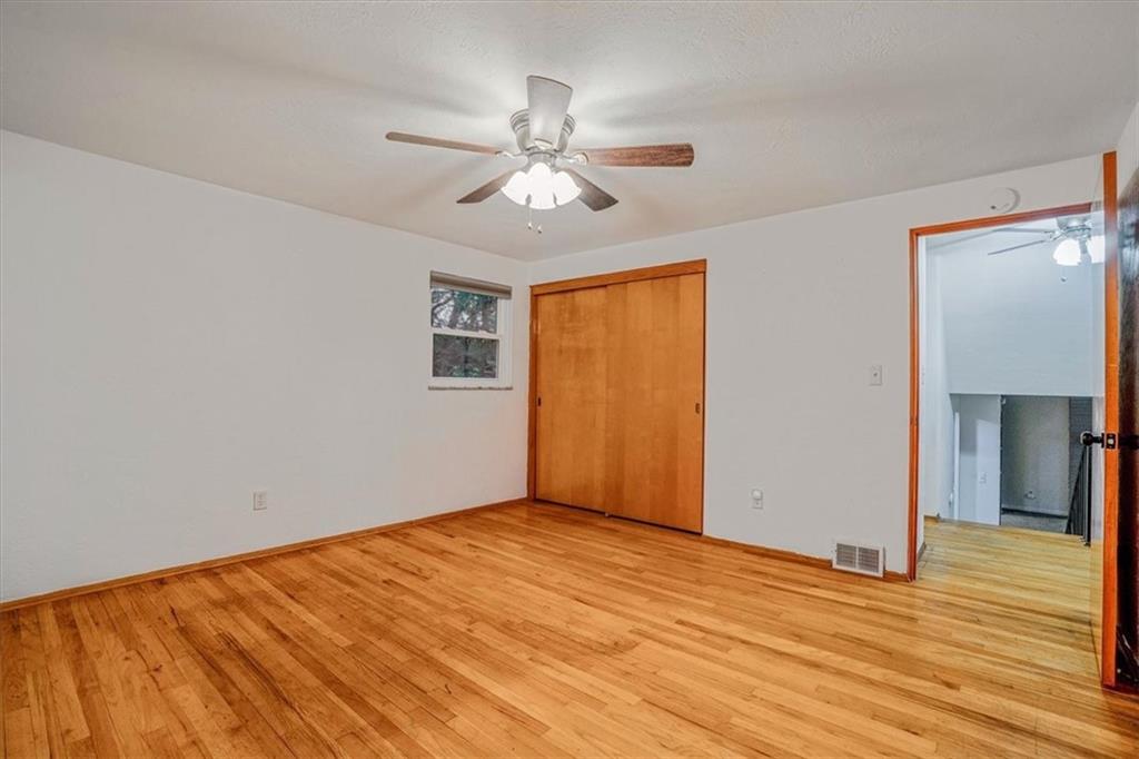 2341 Sample Road Allison Park, PA 15101 - Photo 23 of 50 a view of empty room with wooden floor and fan