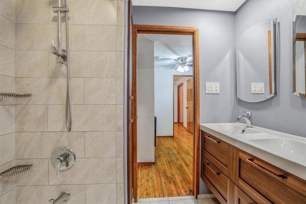 2341 Sample Road Allison Park, PA 15101 - Photo 28 of 50 a bathroom with a double vanity sink a mirror and shower