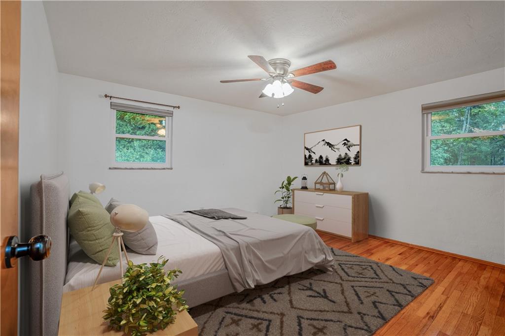 2341 Sample Road Allison Park, PA 15101 - Photo 30 of 50 a bedroom with a bed and a chandelier