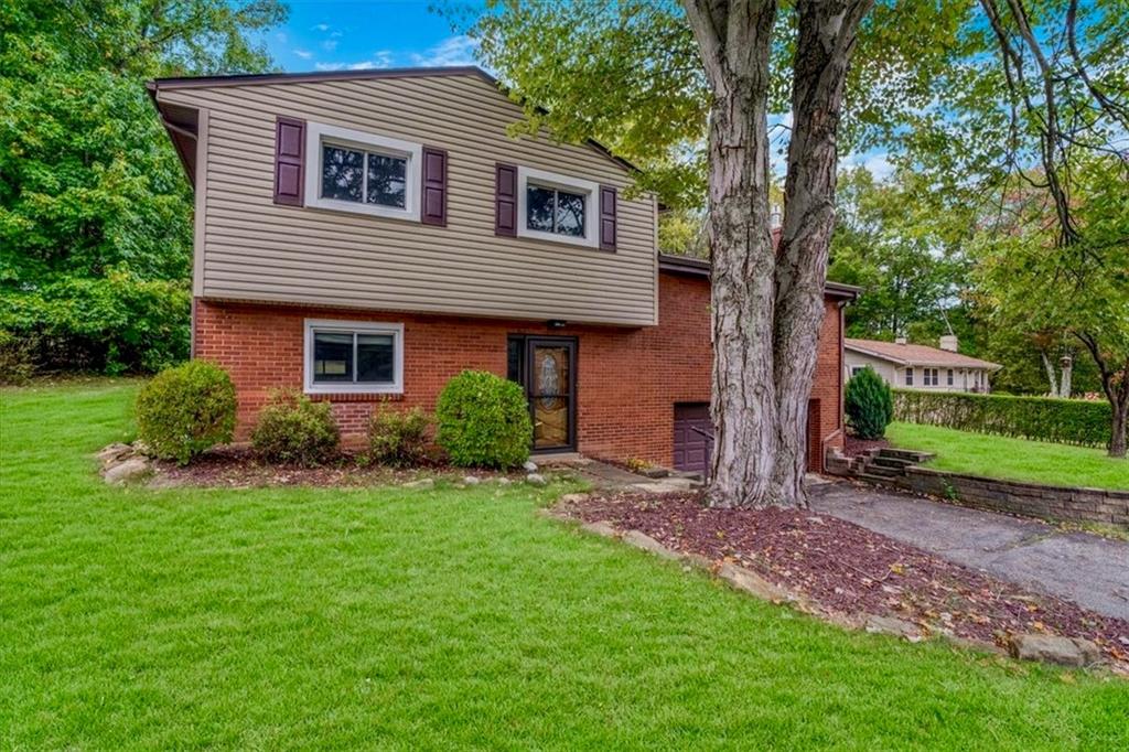 2341 Sample Road Allison Park, PA 15101 - Photo 34 of 50 a front view of a house with garden