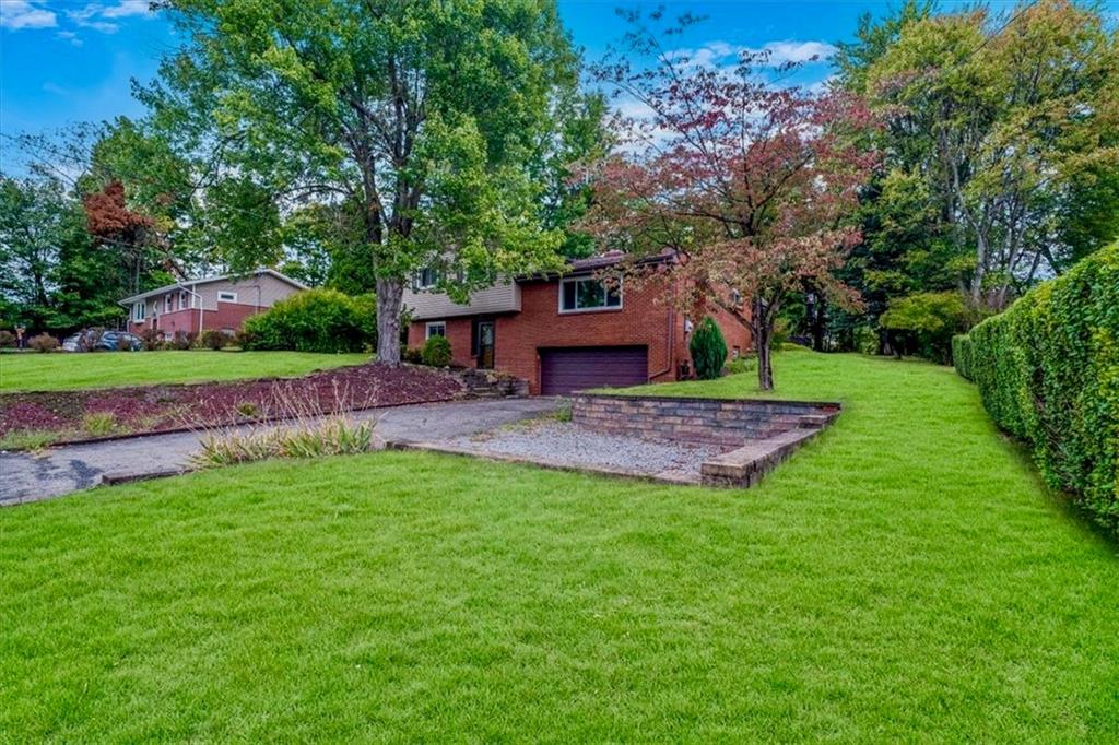 2341 Sample Road Allison Park, PA 15101 - Photo 35 of 50 a view of a backyard with a garden