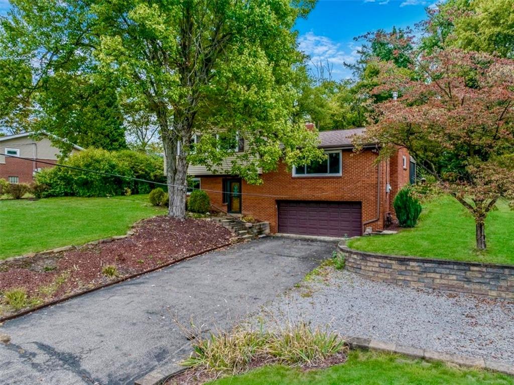2341 Sample Road Allison Park, PA 15101 - Photo 43 of 50 a front view of a house with a yard and a garage