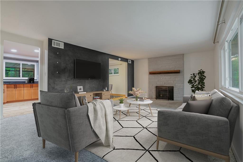 2341 Sample Road Allison Park, PA 15101 - Photo 6 of 50 a living room with furniture a flat screen tv and a fireplace