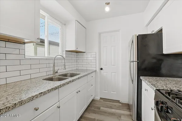a kitchen with appliances and cabinets