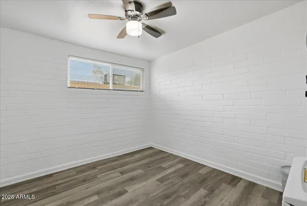 a bathroom with a toilet and shower