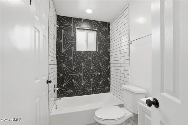 a bathroom with a sink toilet and vanity